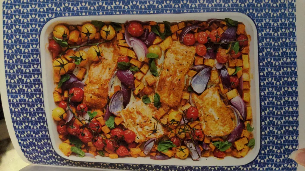 Tandoori-style salmon with spiced roasted sweet potatoes, tomatoes & red onion