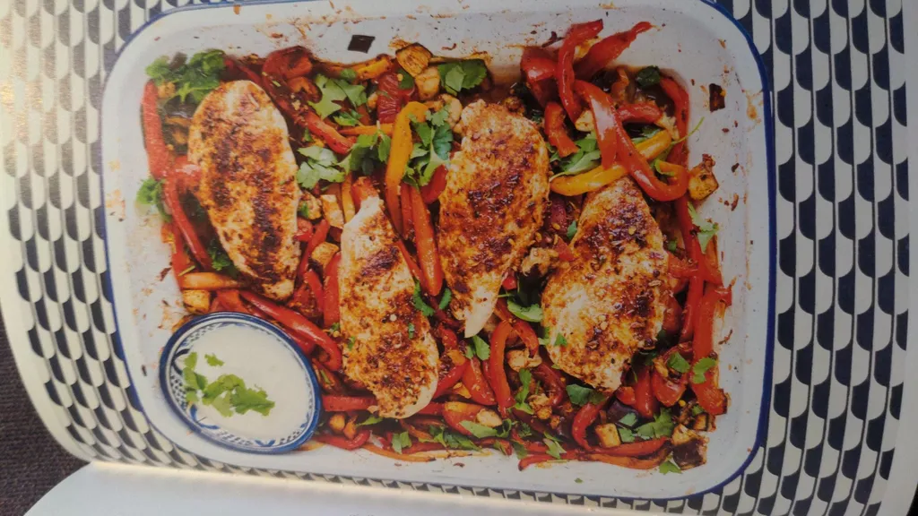 Spiced roast chicken with peppers, aubergine and onion