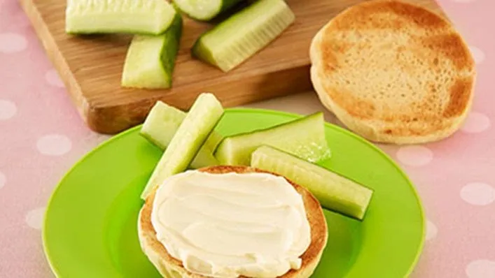 Cheesy English muffins and cucumber sticks